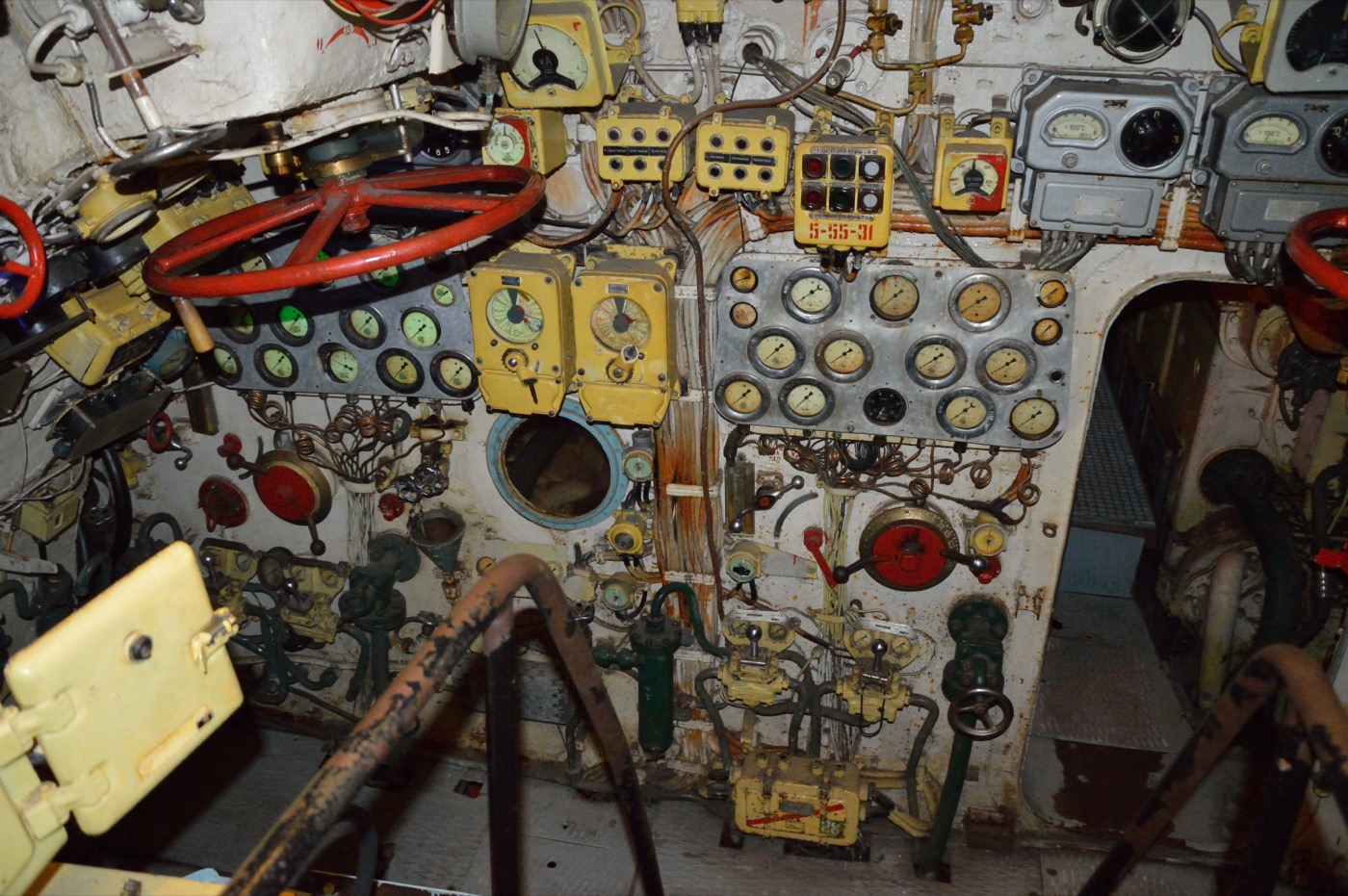 The control room of a Foxtrot-class submarine — a claustrophobic wall of dials, gauges, valve wheels, and switches where the vote on the nuclear torpedo took place