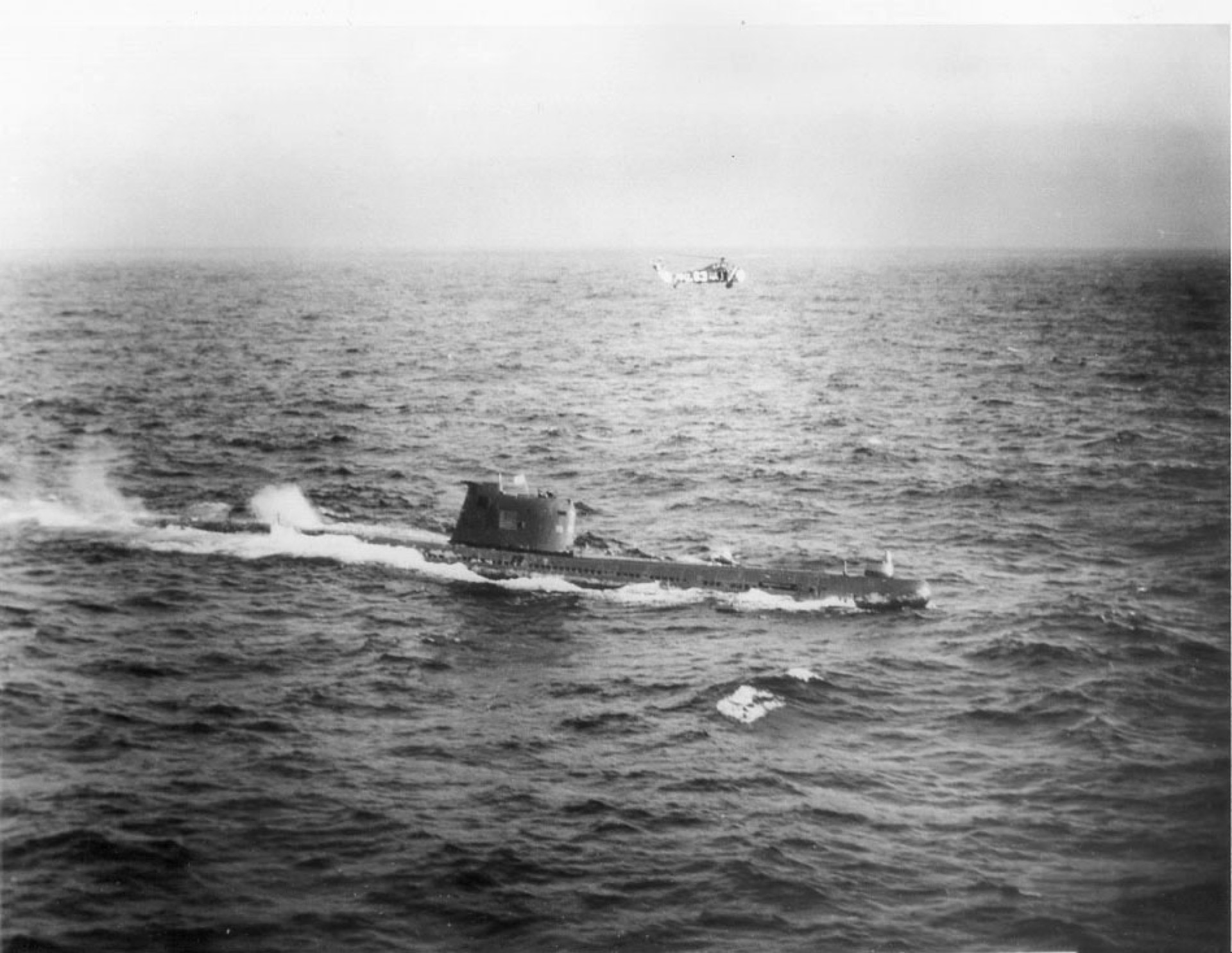 Soviet Foxtrot-class submarine B-59 surfaced in the Atlantic, surrounded by US Navy vessels, October 1962