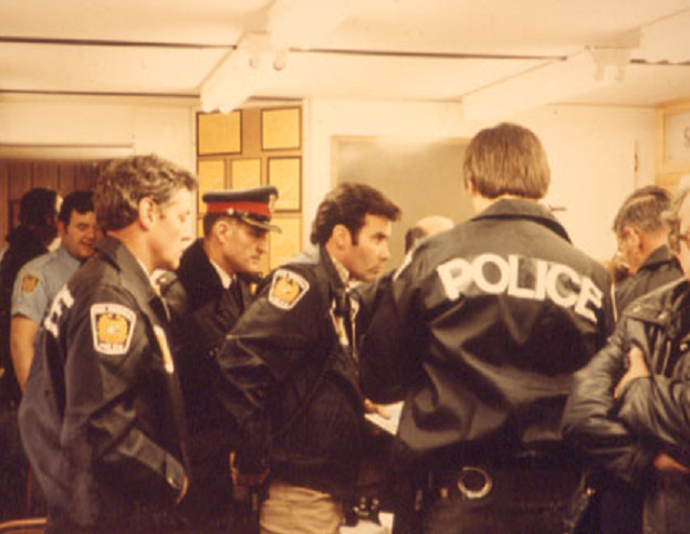 Peel Regional Police officers crowded in the command centre during the Mississauga train derailment evacuation