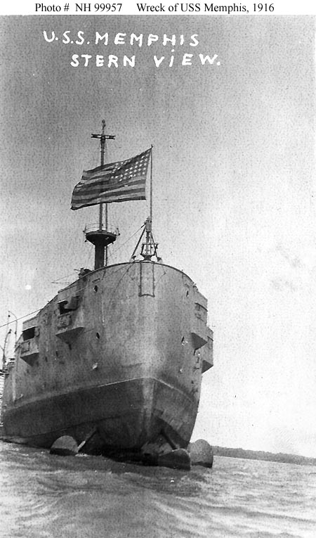 USS Memphis seen from astern, propeller blades visible above the waterline